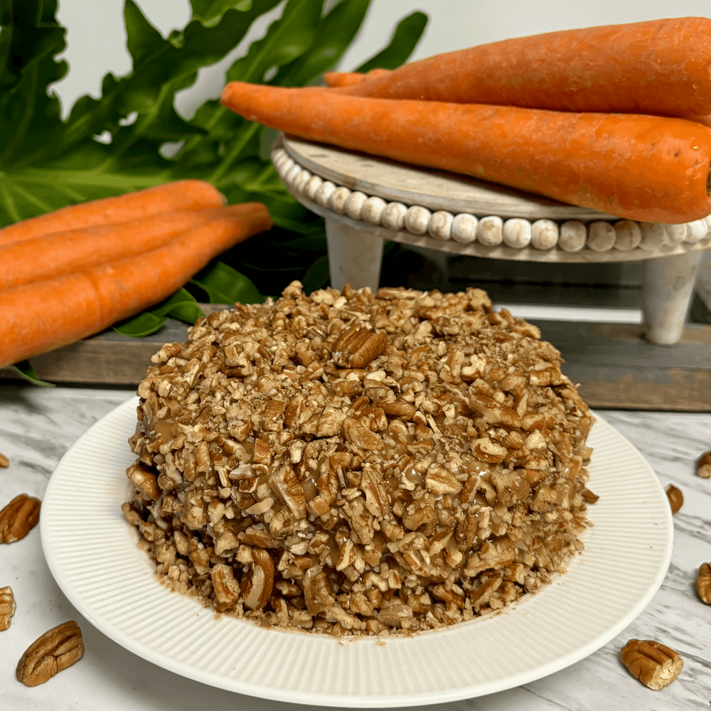 Gluten-free, sugar-free, dairy-free Carrot Pecan Full Life Cake topped with sugar-free caramel syrup and toasted chopped pecans, featuring sweet organic carrots and rich cinnamon for a moist, delicious slice.Full Life Gourmet Bakery