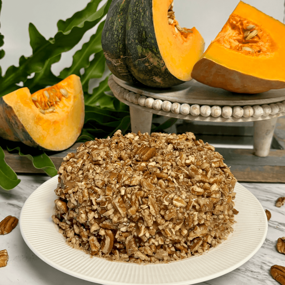 Gluten-free, dairy-free, sugar-free Pumpkin Cinnamon Cake with a sugar-free caramel syrup topping and crunchy pecans, capturing the essence of Thanksgiving flavors. Full Life Gourmet Bakery